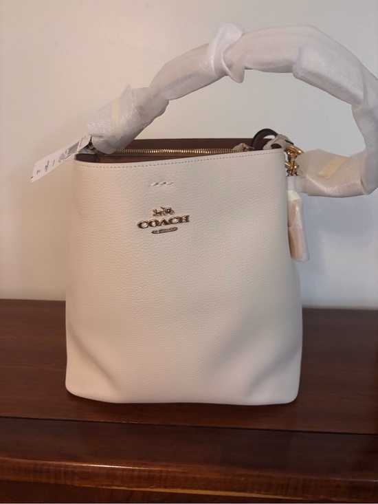 Coach Handbags - Coach Cream Pebbled Leather Mini Bucket Crossbody with Gold Hardware